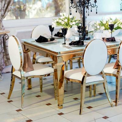 China Modern Luxury Rectangle Dining Room Furniture Table And Chairs Golden Stainless Steel Dining Table With White Glass Top For 6 People for sale