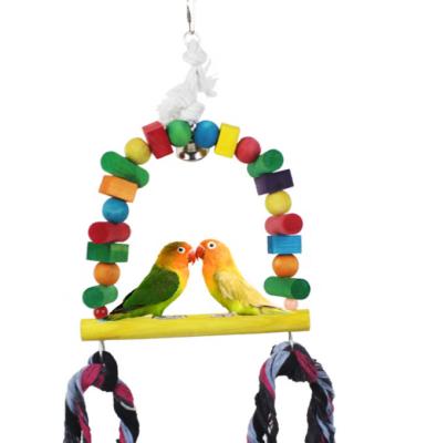 China Viable Hot Selling Natural Wooden Pet Chewing Hanging Toy Parrot Bell Parrot Cage Swing Toy For African Gray Parrot for sale