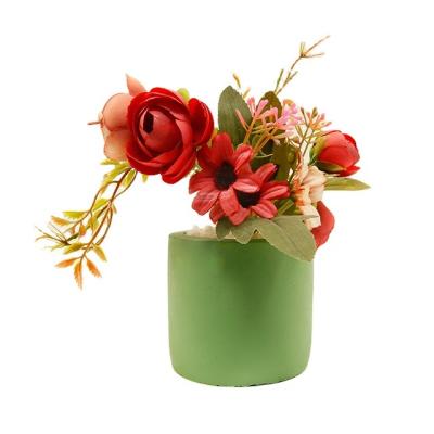 China PE Artificial flowers in concrete pot modern home decor Faux potted Greenery for sale