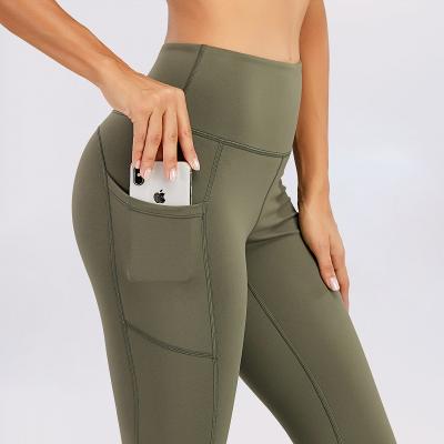 China Breathable Women Yoga 7/8 Gaiters Solid Color High Waist Yoga Pants Gaiters With Pocket for sale