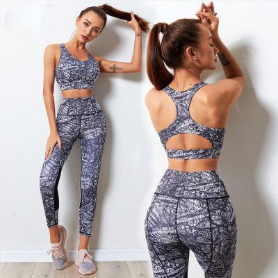 China Cavity Breathable High Quality Ladies Gym Sports Bra And Pants Jacquard Floral Print Two Piece Yoga Set Fitness Women for sale