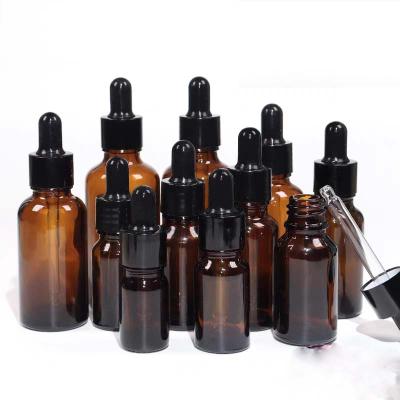 China Personal Care Hot Sale Cosmetic Packaging Amber Glass Essential Oil Bottle Perfume Bottle Dropper Bottle Black Cap for sale