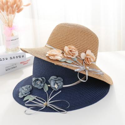 China Women's Checked Beach Flowers Foldable Hat Simple Summer Sun Hat Seaside Floppy Straw Hats for sale