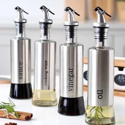 China Sustainable Oil Dispenser Glass Bottle With Premium Stainless Steel for sale