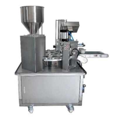 China Automatic Filling Sealing Rotary Plastic Cup Filling And Sealing Machine Automatic Water Cup Filling Sealing Machine for sale