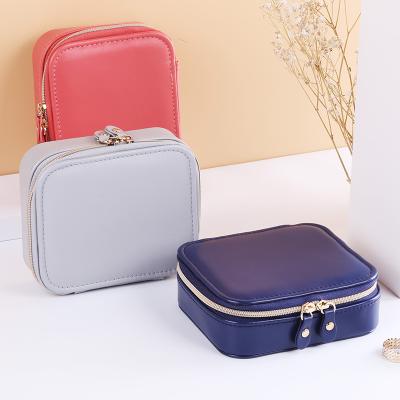 China PU Leather Jewelery Boxes Portable Custom Zipper Solid Color Leather Double Travel Jewelry Organizer for sale