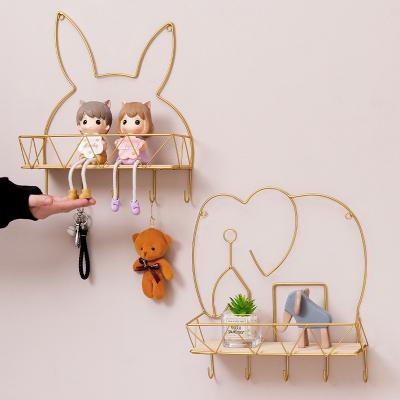 China Simple And Creative Animal Shape Wall Mounted Toilet Rack Minimalist Wall Mounted Toilet Rack For Home Decor for sale