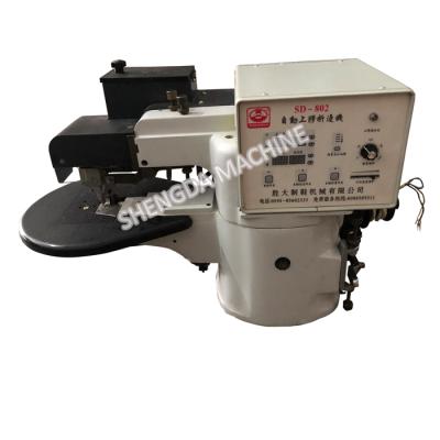 China Automatic strape floding shoe material PU leather belt edge folding machine shoe material gluing machine for leather goods for sale