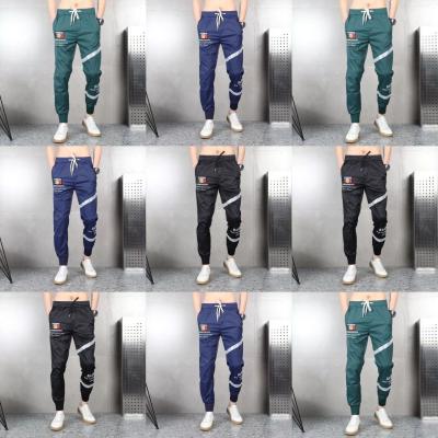 China factory wholesale men's pants men's casual pants cheap hot stripe casual pants Anti-wrinkle jogging pants pocket sports for sale