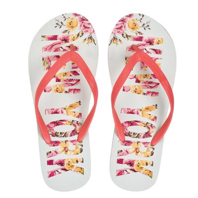 China Fashion Trend Letter Transfer Printing Artistic Floral PVC Upper Cusioned Eva Embossed Flower Flip Flops For Women for sale