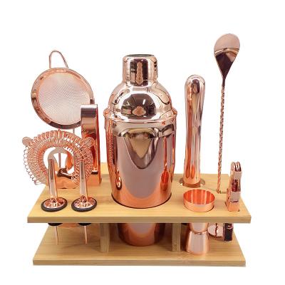 China Sustainable Wine Accessories Barware Set 11pcs Rose Gold 550ml Cocktail Shaker Set With Wooden Stand for sale