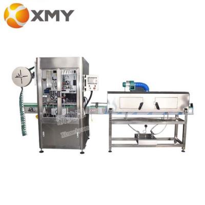 China Beverage sleeve labeling machine sleeve labeling machine automatic bottle sleeve labeling machine heat shrink tunnel for sale