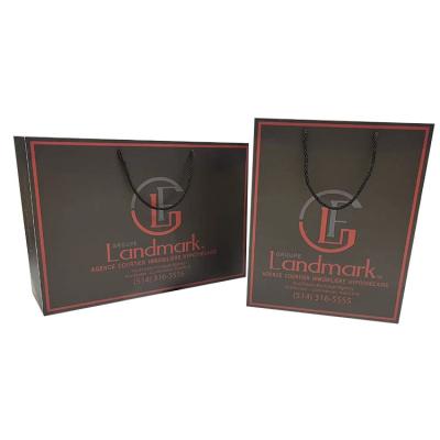 China Recycled Materials Wholesale Logo Design Luxury Clothing Retail Custom Gift Jewelry Shopping Black Paper Bags With Your Own Logo for sale