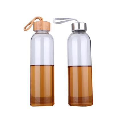 China Viable Leak Free BPA Free Borosilicate Glass Reusable Bottle With Stainless Lid Wholesale Glass Water Bottle With Bamboo Lid for sale