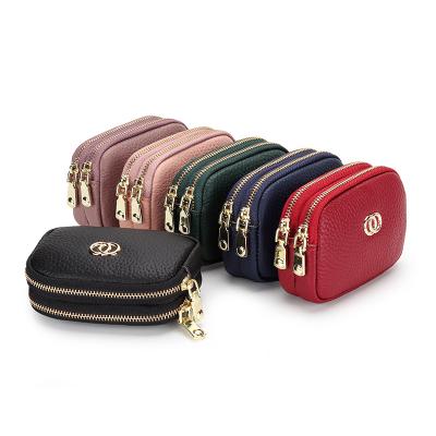 China Fashion Mini Hand Stake Coin Purse Women Lipstick Waterproof Genuine Leather Korean Leather Coin Bag Short Simple Storage Bag for sale