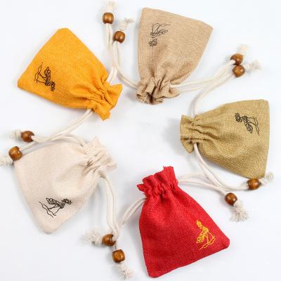 China Lotus Gift Small Hessian Hessian Canvas Drawstring Bag Jute Pouch Drawstring Gift Wrapping Bag With Buddhist Bead Pendant for sale