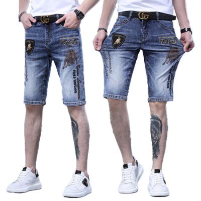 China 2022 QUICK DRY Men's Lattice Shorts Street Style Blue Embroidered Denim Ripped Casual Jeans Character Shorts Bull Texture Rhinestone for sale