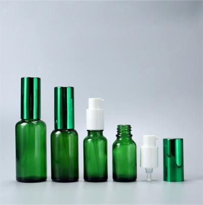 China Green Cosmetic Pump OEM Cosmetic Glass Bottle For Essential Oil for sale