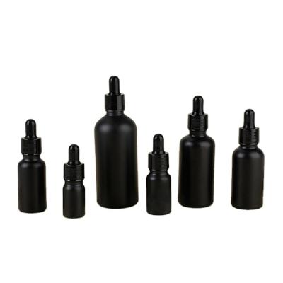 China Cosmetic Essential Oil Matte Black Serum Bottle Glass Essential Oil Dropper Bottle With Calibrated Glass Pipette for sale