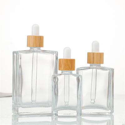 China 30ml 50ml 100ml Square Cosmetic Bottle Essential Oil Glass Bottle With Dropper Cap Or Other Cap for sale