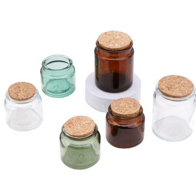 China Luxury Cosmetic Candlestick Cosmetic Packaging Glass Jar With Wood Stopper Customized Colors Glass Cosmetic Packaging Jar for sale