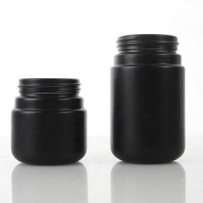 China Black Round 3.5g 20dram 90ml Dispensary Bottle CR Food Coating Freeze Child Proof Glass Jar With Heavy Duty Double Dome Tall Lid for sale