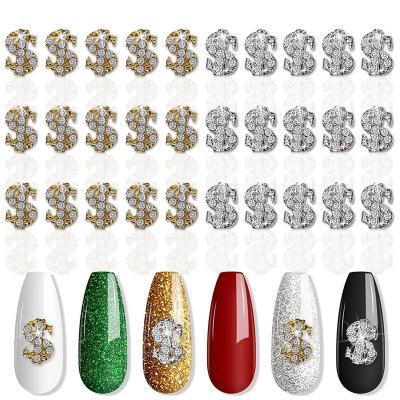 China Fashion Design New Arrival Metal Silver Dollar Symbol Nail Charms Rich Luxury Rhinestone Art Crystals Dollar Shape 3d Nail Charms for sale