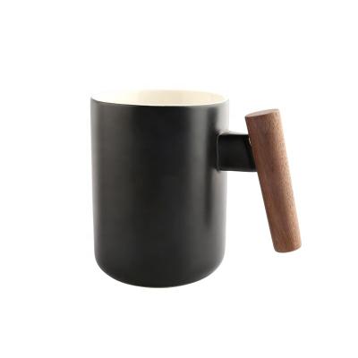 China Sustainable New Arrival 12oz Coffee Mug Ceramic Mugs With Wooden Handle for sale