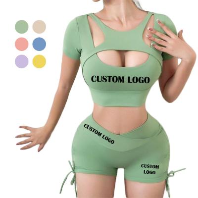 China Womens Breathable Fitness And Yoga Wear Sexy Gym Custom Womens Clothing Hollow Out Drawstring Spandex Womens Sets 2 Piece Shorts Set for sale