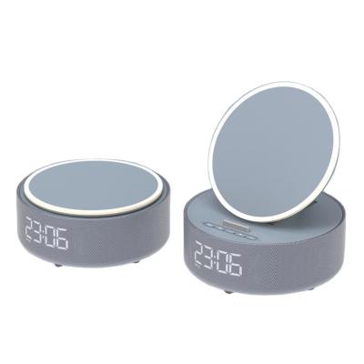 China Multifunctional mobile phone night light makeup mirror speaker clock alarm four-in-one the fast wireless charger for sale