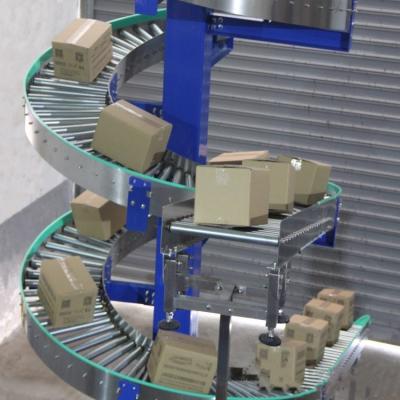 China Heat Resistant BeverageTransfer Spiral Conveyor Heavy Load Plastic Food Conveyor Different Floors Transfer Cardboard for sale