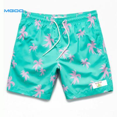 China MGOO Boys Breathable Breathable Custom Swim Shorts Fishing Male Beach Skin Green Fabric Palm Print Trunks Boardshorts For Men Split Leg Opening for sale