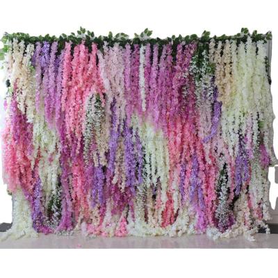 China Fashionable Wedding Decorations Wedding Wall Home Decor Hanging Roll Up Cloth Base Artificial Flower Wall Panel Backdrop Wisteria Flower Wall for sale