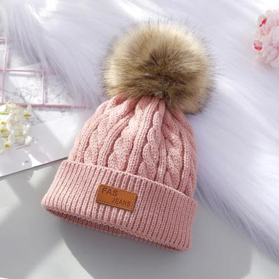 China The new autumn and winter COMMON wool ball knitted hat personality children's wool letter labeling children hat for sale