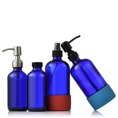 China Personal Care 500ml Shampoo Wholesale Amber Round Clear Spray Glass Boston Blue Bottle With Stainless Steel Soap Pump Dispenser for sale