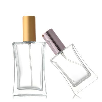 China Luxury 30ML Gold Refillable Empty Liquid Clear Square Cap Personal Care Packaging Glass Perfume Bottle for sale