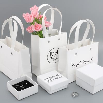 China Paper Customized Pink Peritoneal Jewelry Packaging Handbag Jewelry Box Set for sale