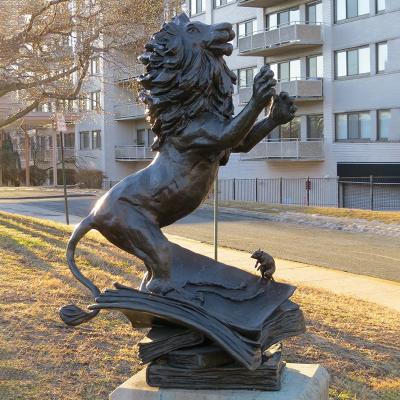 China Nice Europe School Park Decor Metal Dancing Lion Sitting On The Book Sculpture For Sale for sale