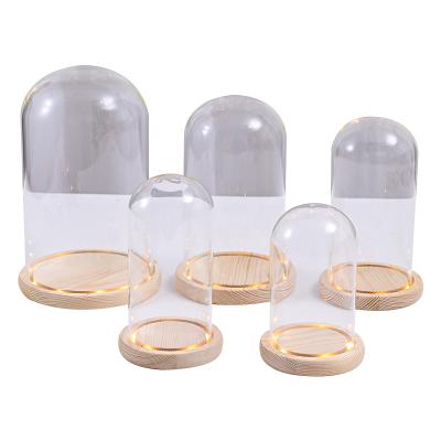 China Wholesale Custom Hot Sale China LED Hand Blown Flower Roses Glass Cloche Glowing Glass Domes With Wooden Base for sale