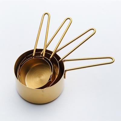 China Viable Stainless Steel Metal Measuring Cups Set Wholesale Golden Kitchen Measuring Tools for sale