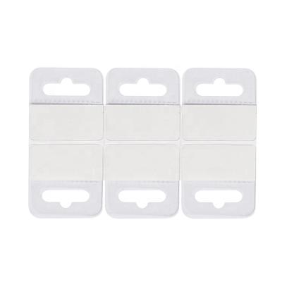 China Euro Hole Eco-friendly Hang Tabs Box Hanger Foldable Sticky Hanging Tab Hooks Plastic Clear Self Adhesive for sale