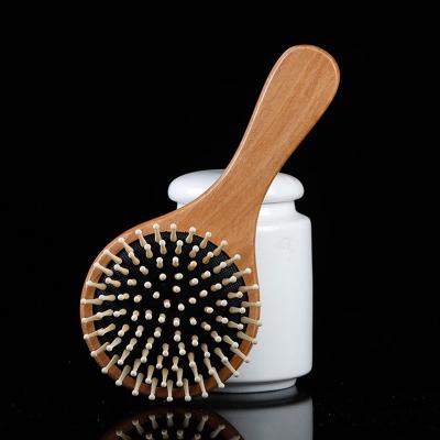 China Anti Static Cushion Comb Spa Wood Hair Comb 1pc Wooden Paddle Brush Home Static Massage Headed Handle Teeth Hair Care for sale