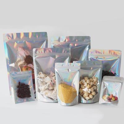 China Disposable Shiny Plastic Food Packaging Snack Food Packaging Zipper Tear Notch Bag Laser Line Holographic Bag for sale