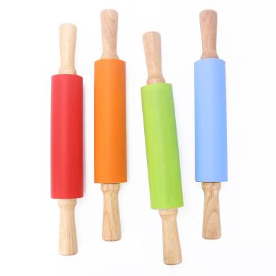 China Viable Non-Stick Silicone Pin With Handle Holder Dough Roller Tools Kitchen Instrument Wooden Tools for sale