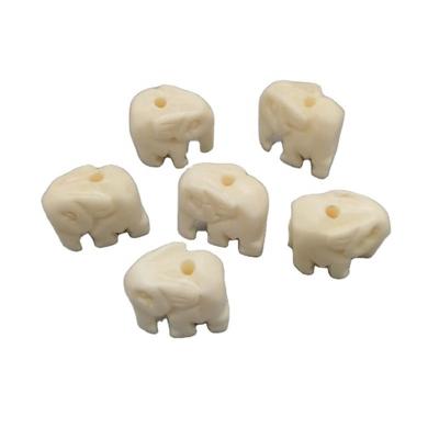 China Charms for Jewelery Other Accessories Daning 3 Different Sizes Exquisite Hand Carved Natural Cattle Bones Stance White Elephant Animal Charm Beads for Jewelry Making for sale