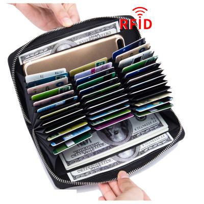 China Durable RFID Blocking Pure Leather Multi-function Zipper Stand Large Capacity Credit Cards Wallet Minimalist Women Wallet for sale