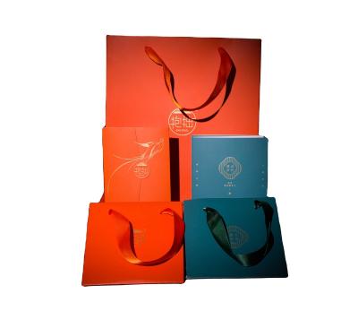 China Recycled Materials Custom Fashion Your Own Logo Print Cosmetics Luxury Gift Shopping Paper Bags With Ribbon Handle for sale