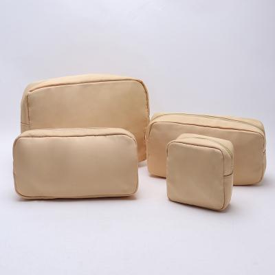 China Fashion Waterproof Nylon Durable Toiletry Bag Cosmetic Bag Solid Color Female Makeup Bag Travel Toiletry Cosmetic Bag for sale