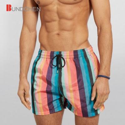 China OEM Breathable Custom Rainbow Striped Print Elastic Drawstring Panel Shorts Trunks Mens Beach Pants for sale