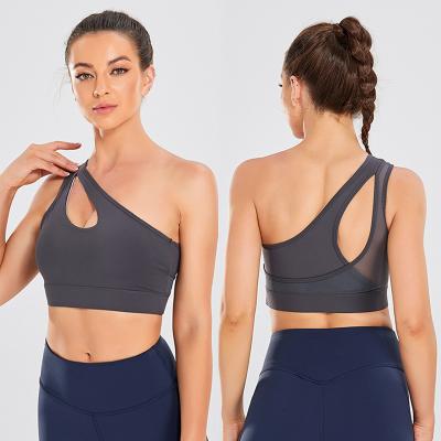 China Action Solid Color Stretch Mesh Shockproof Gather One Shoulder Cutout Breathable Teams Gym Yoga Bra for sale